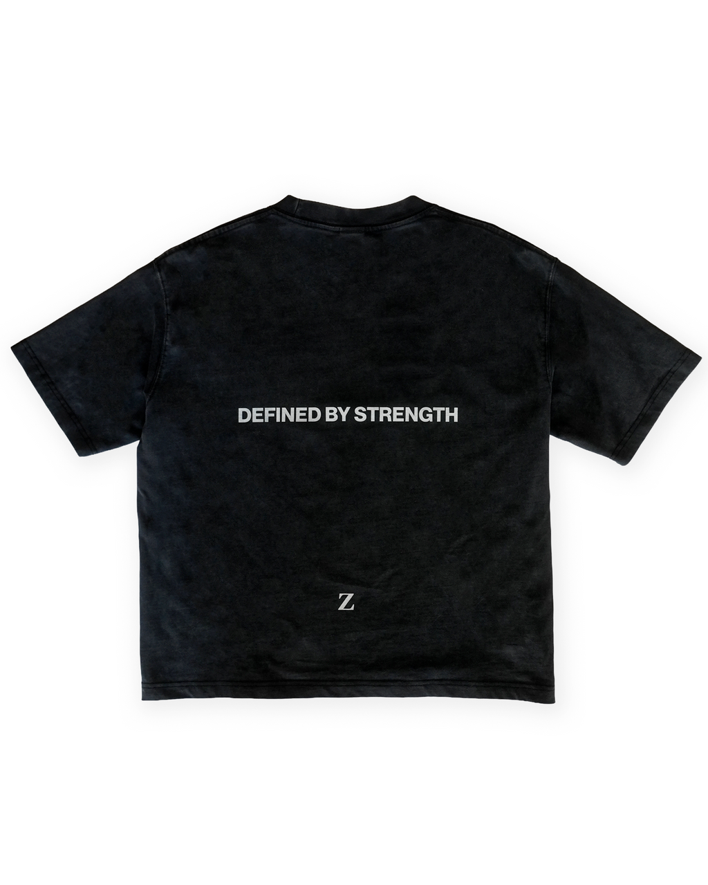 Zelos Tee Black — back flat lay with Defined by Strength print