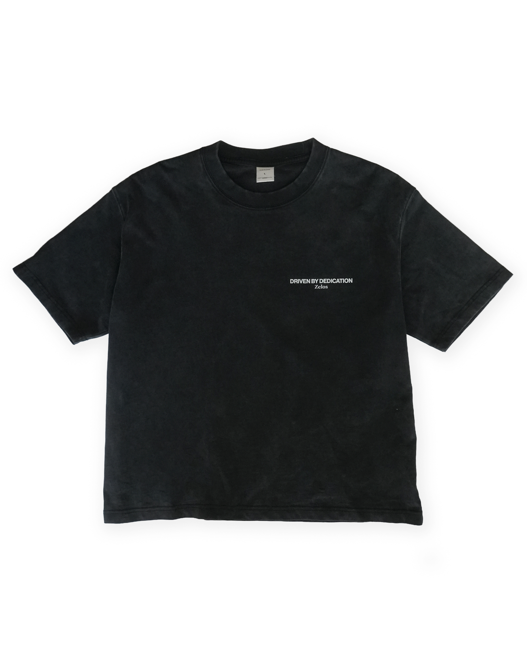 Zelos Tee Black — front flat lay with Driven by Dedication chest print